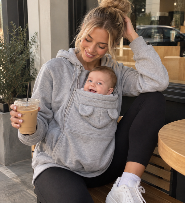 Parent and baby in a cafe, from original MOMI storefront